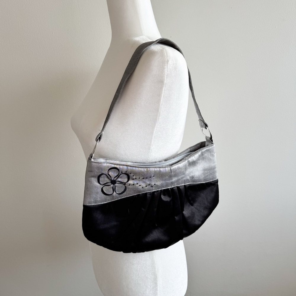 Silver and Black Satin Baguette Bag by Jak’s with flower embroidery details